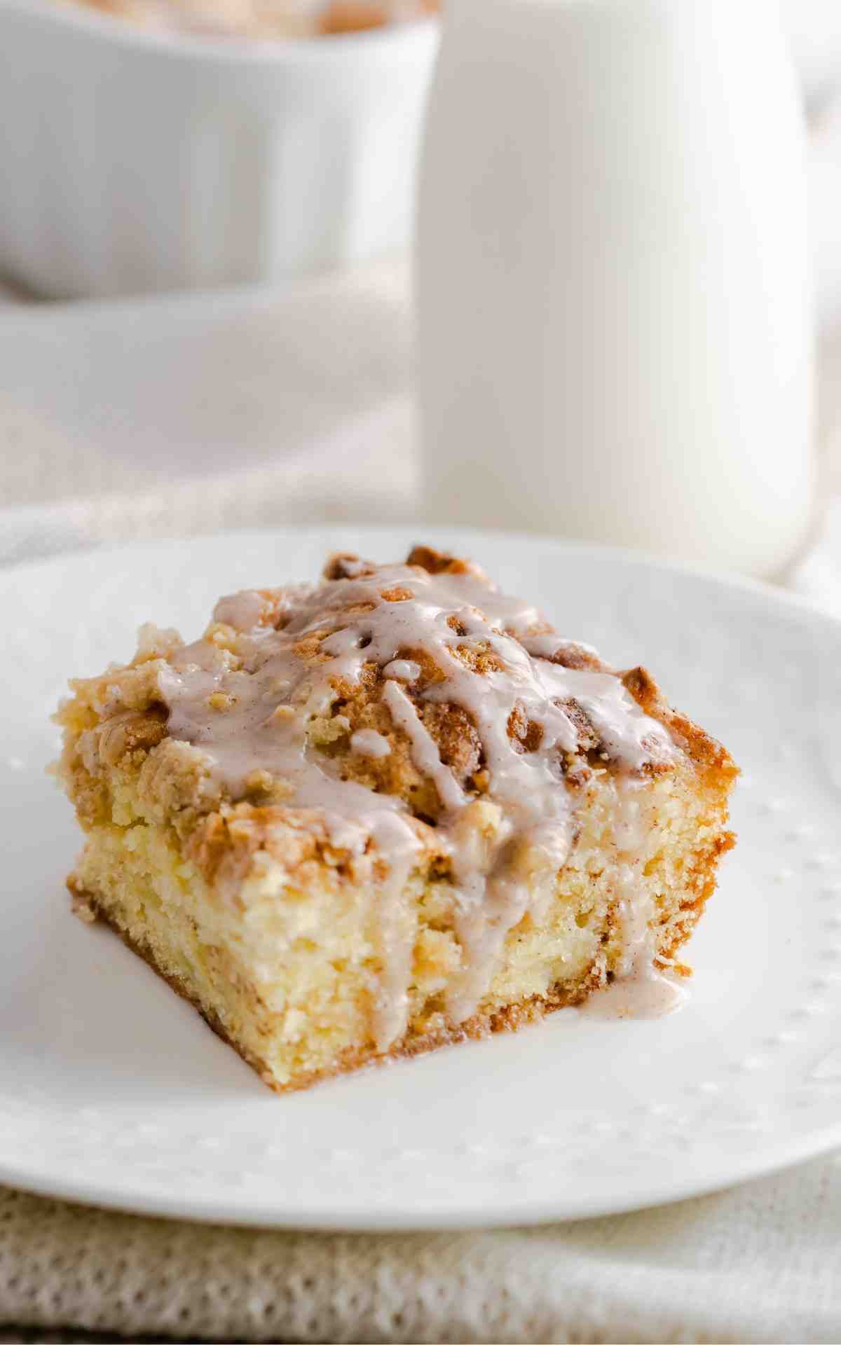 Apple crumb coffee cake on a white plate.