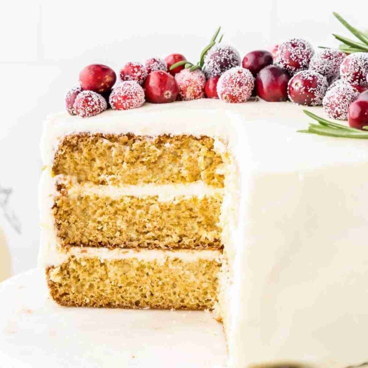 Eggnog cake with frosted cranberries on top.