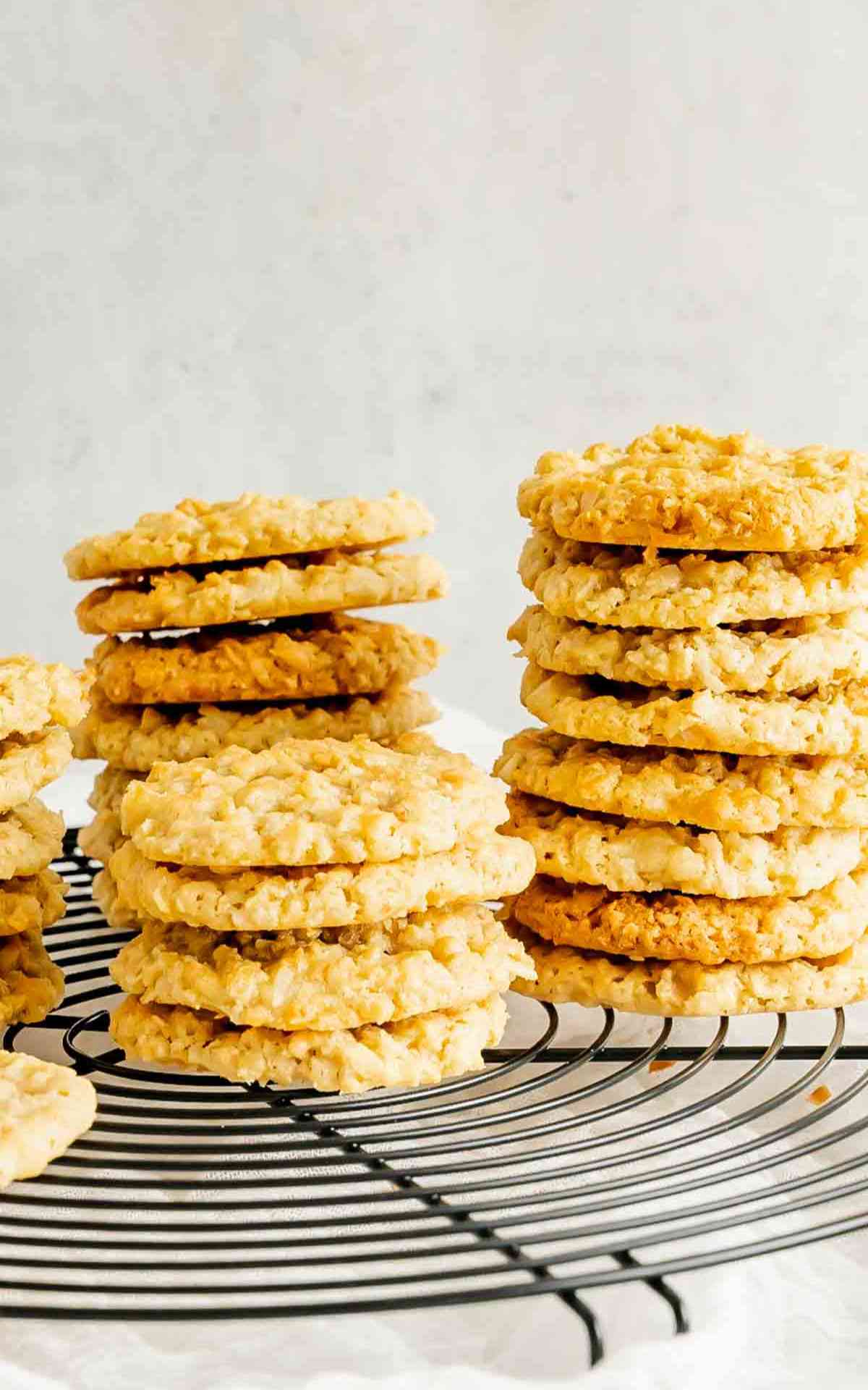 Stacks of classic old fashioned cracker jack cookies on a cooling rack.