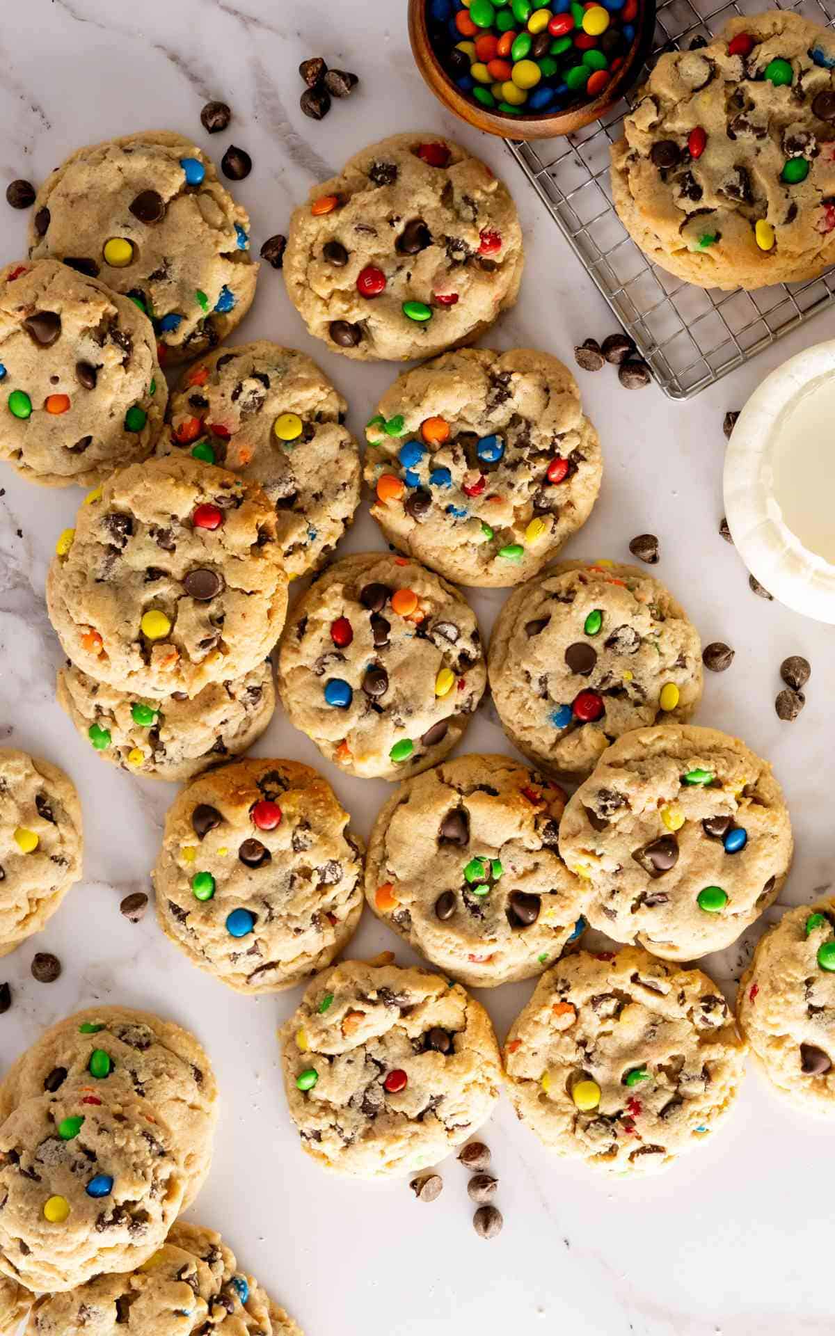 Chocolate Chip Peanut Butter Cookies with M&Ms scattered on the counter.
