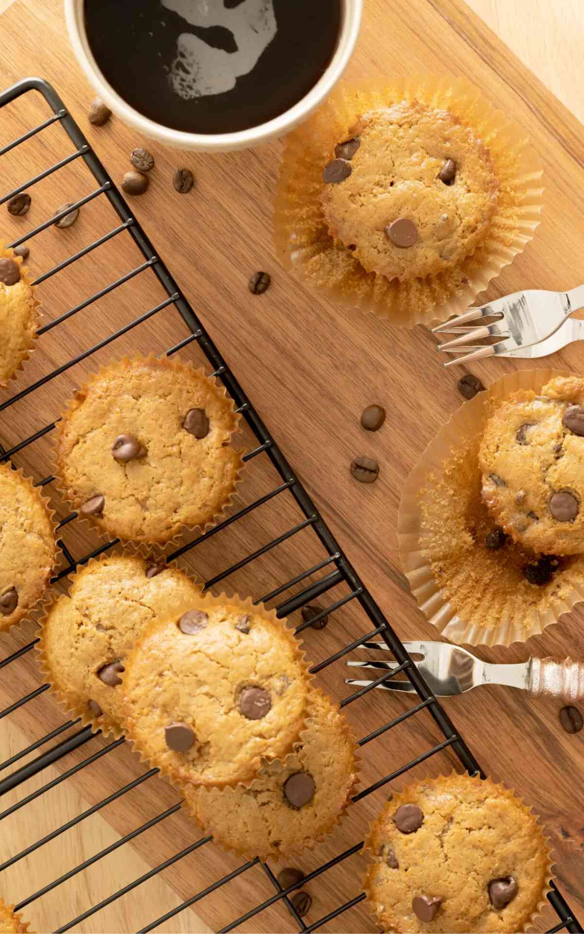 Overhead image of scattered cappuccino muffins on a cooling rack.