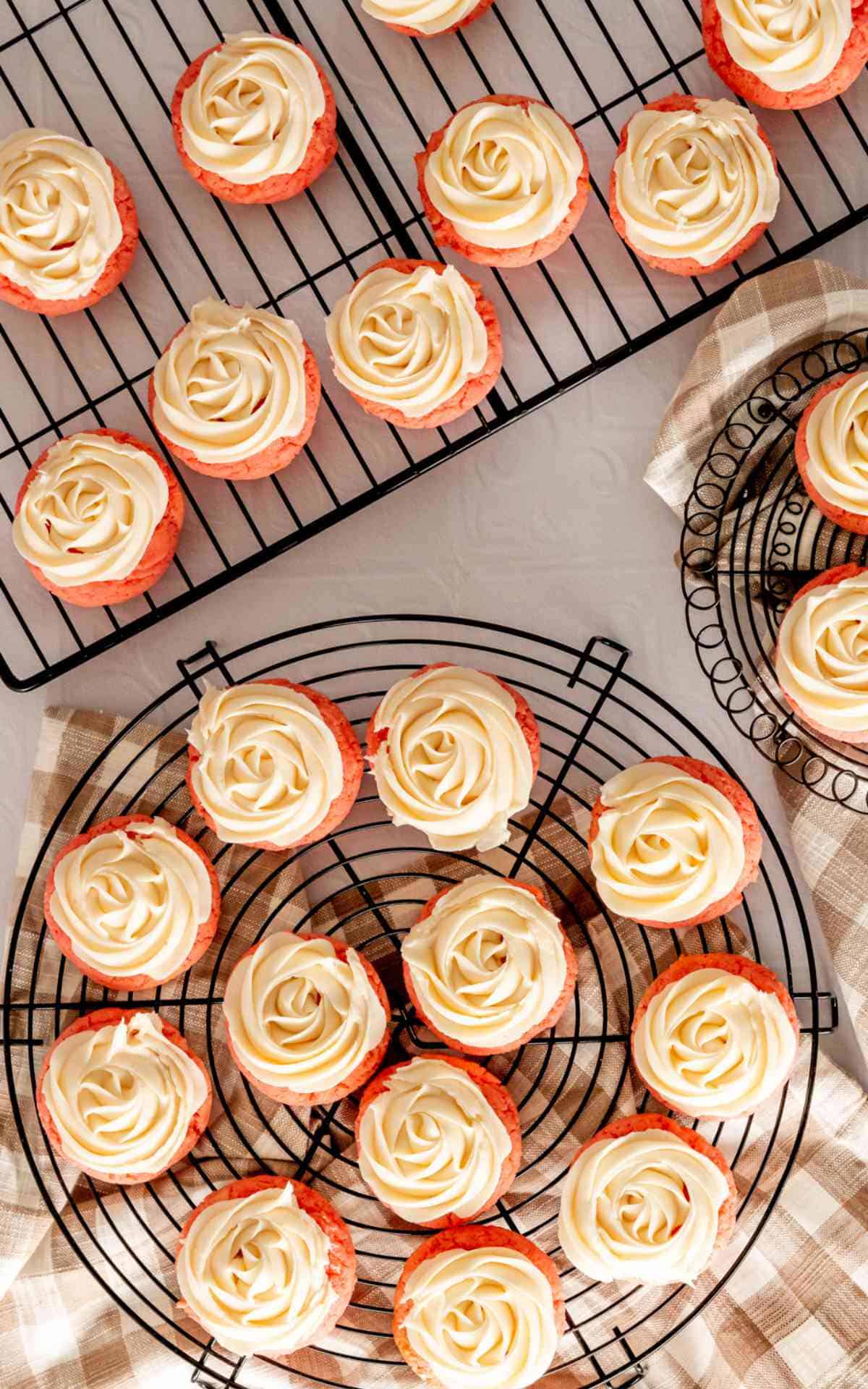 Birdseye view of pink lemonade cookies that have piped rosettes.