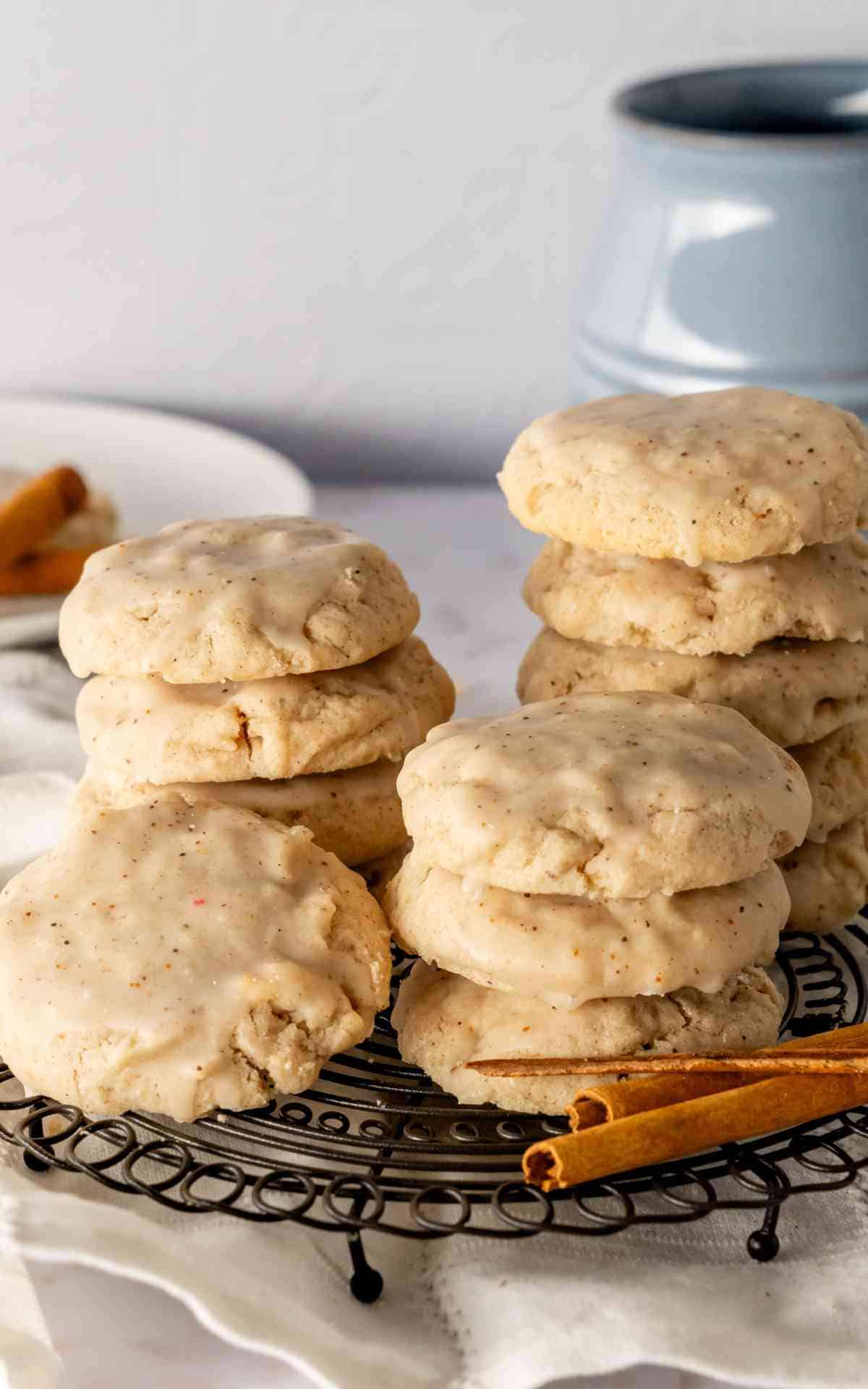 Stacks of chai sugar cookies on a round cooling rack.