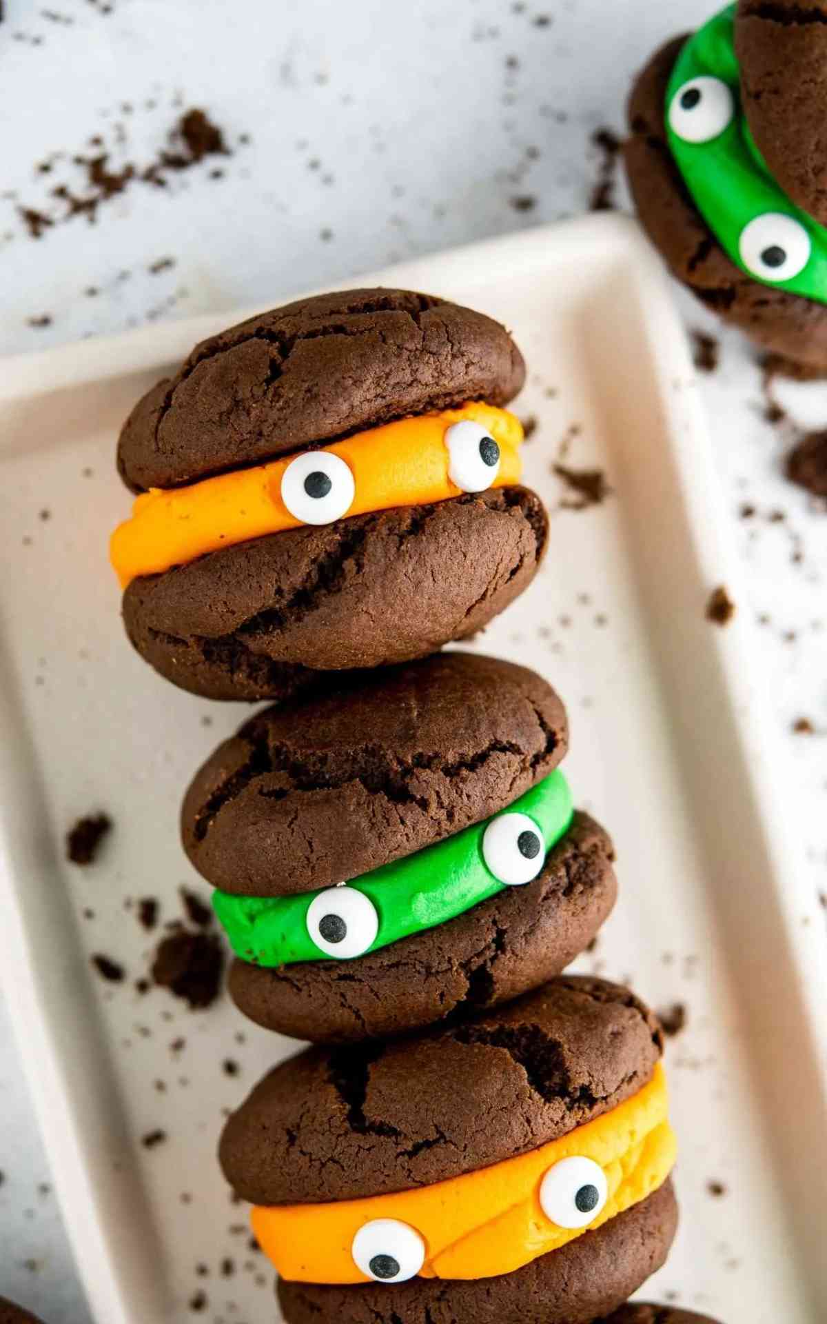 Three easy Halloween cookies with green and orange icing.