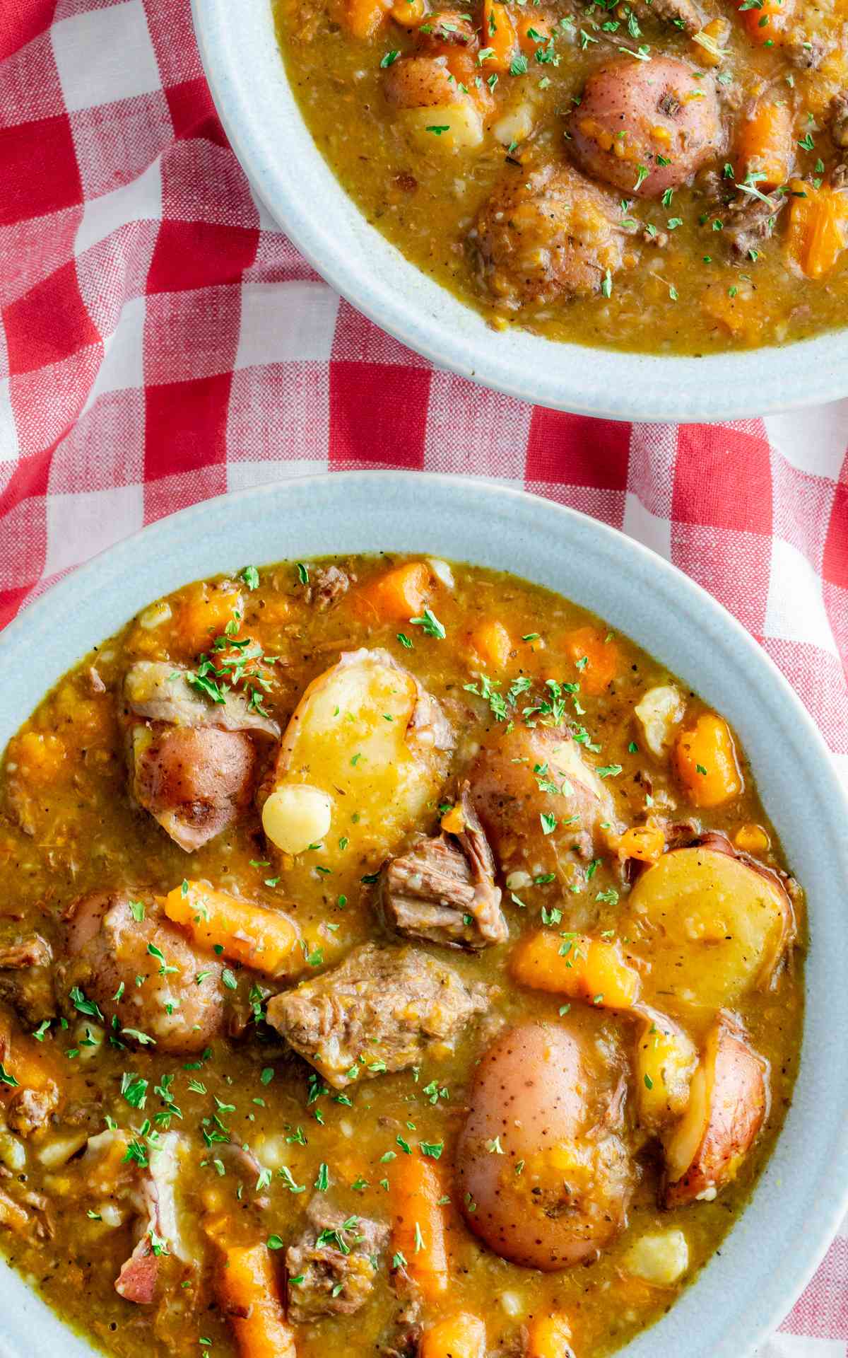 Overhead photo of beef stew with red potatoes chuck roast and other vegetables.