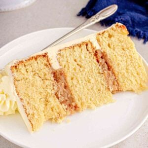 Layered pecan pie cake with frosting featured image.