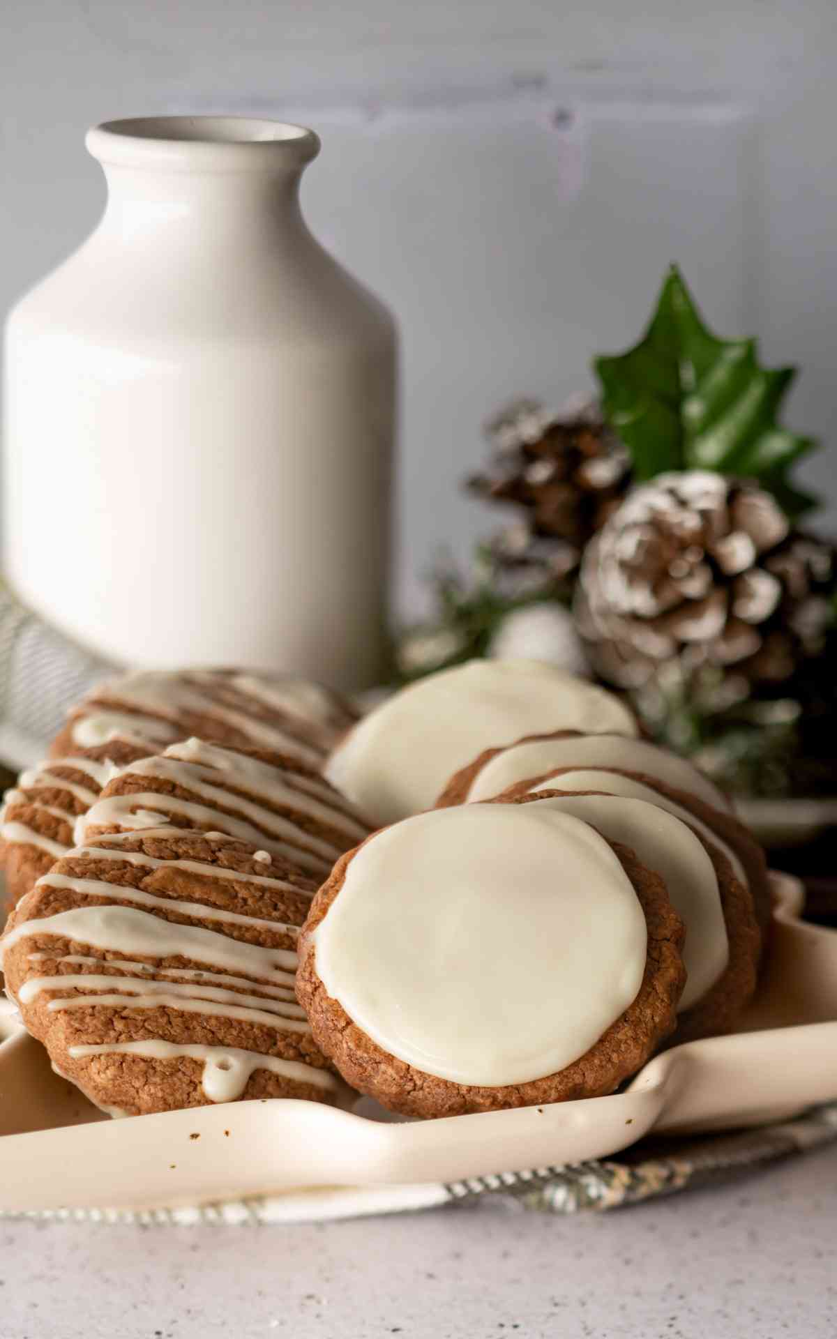 Chocolate Orange Cookies glazed on a Christmas tree plate.
