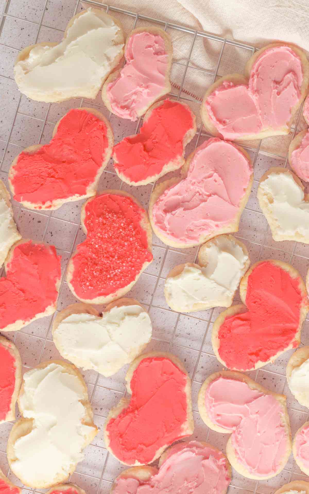 Birdseye view of heart cream cheese sugar cookies with buttercream frosting.