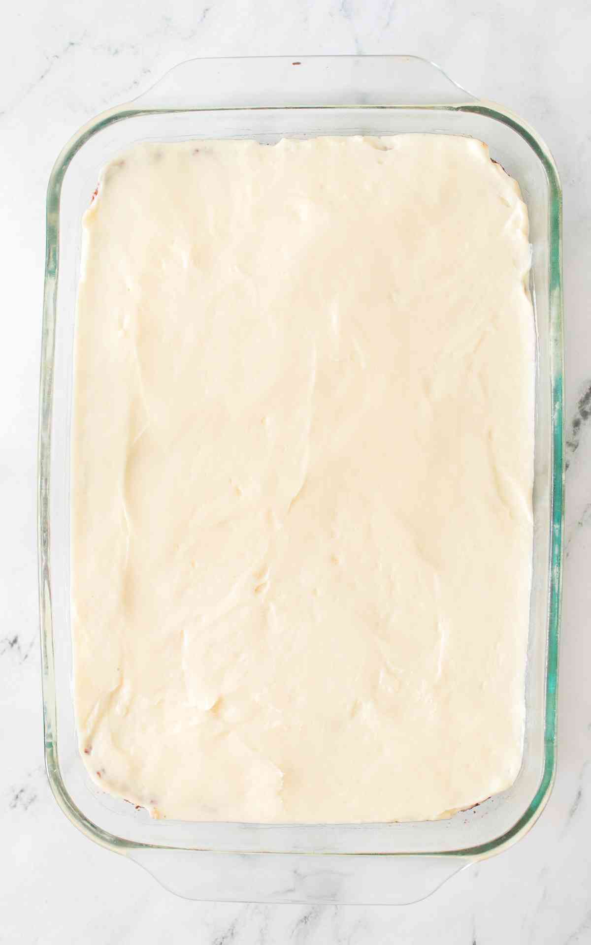 Frosted red velvet bars in a glass dish.