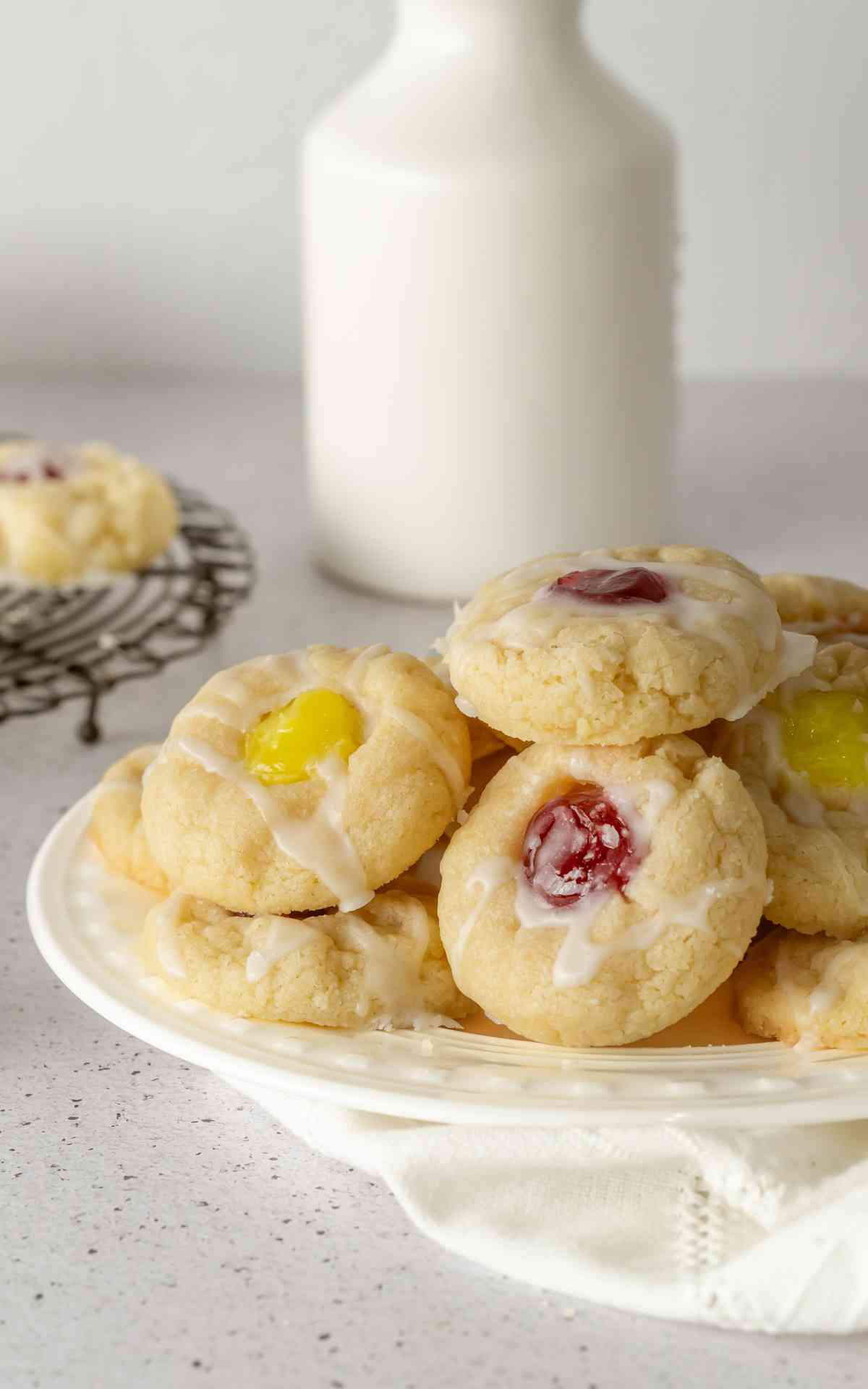 Shortbread Thumbprint cookies on a white plate.