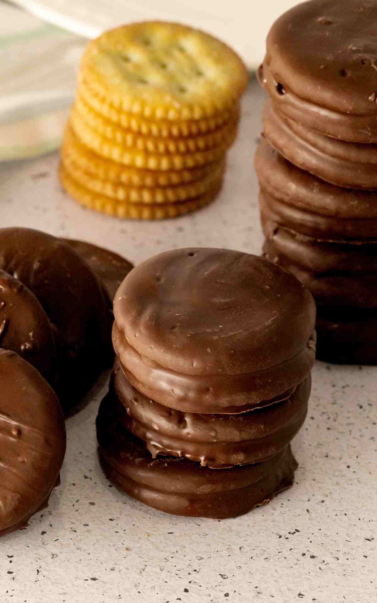 A few chocolate covered ritz crackers on the counter.