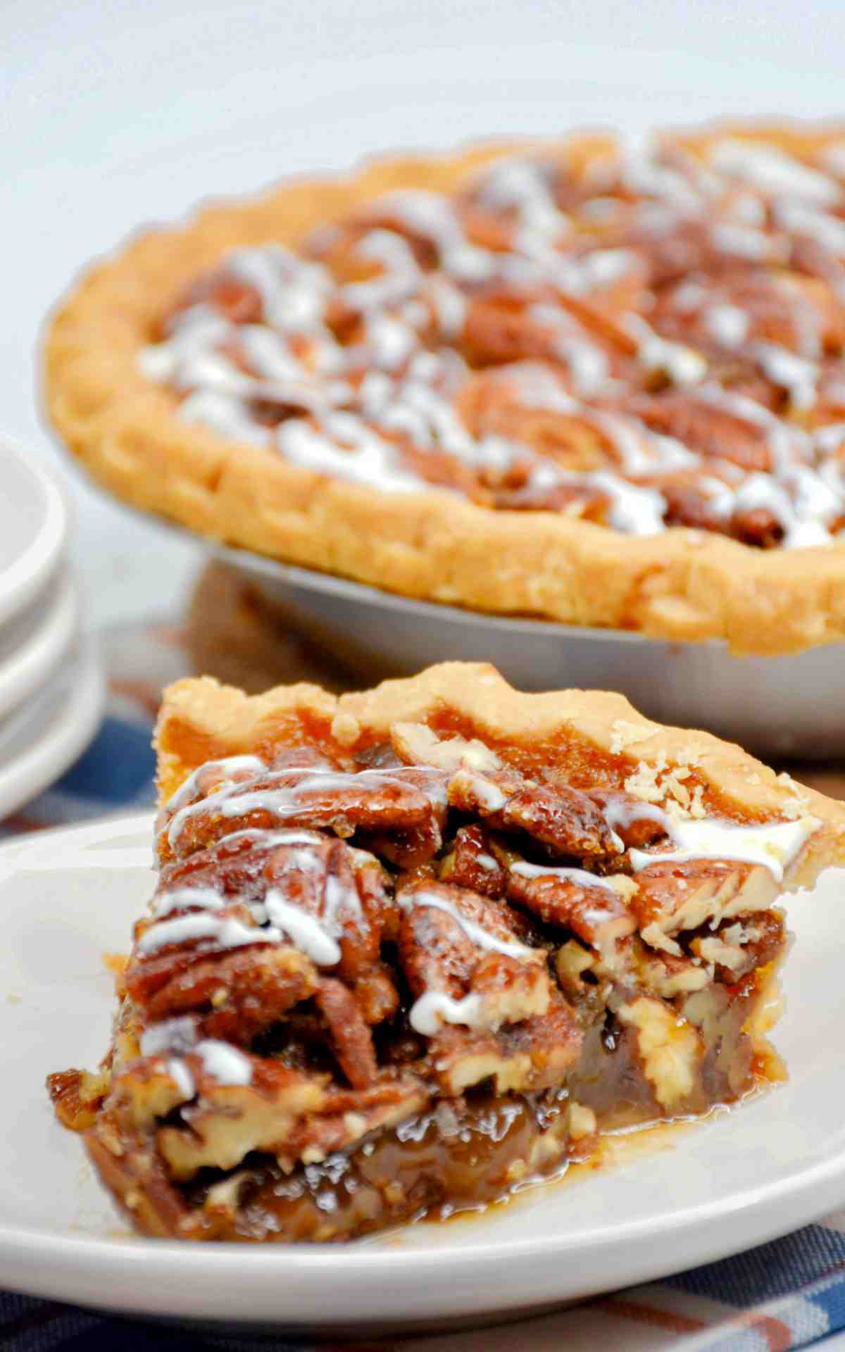 A slice of bourbon pecan pie on a plate.