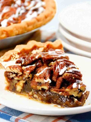 Bourbon Pecan Pie slice on a saucer featured image.