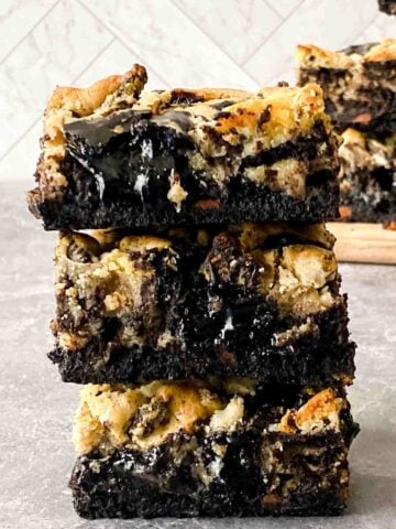 Oreo Brownies stacked on counter featured image.