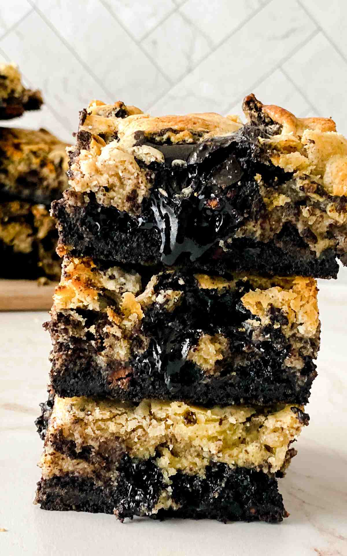 Oreo brownies stacked three high on counter.