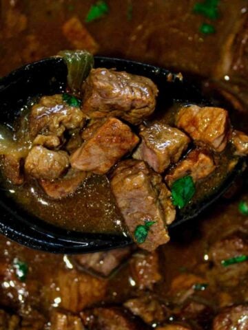 Slow Cooker Beef Tips and Onion Gravy in a crockpot featured image.