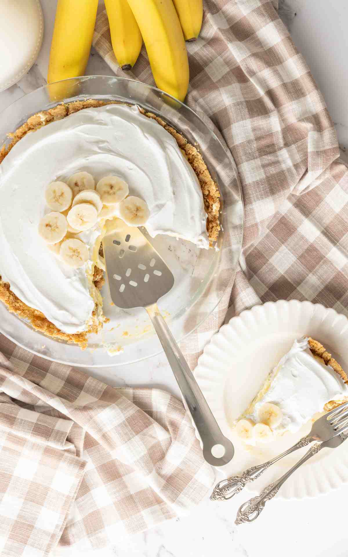 A sliced banana cream pie with nilla wafer crust.