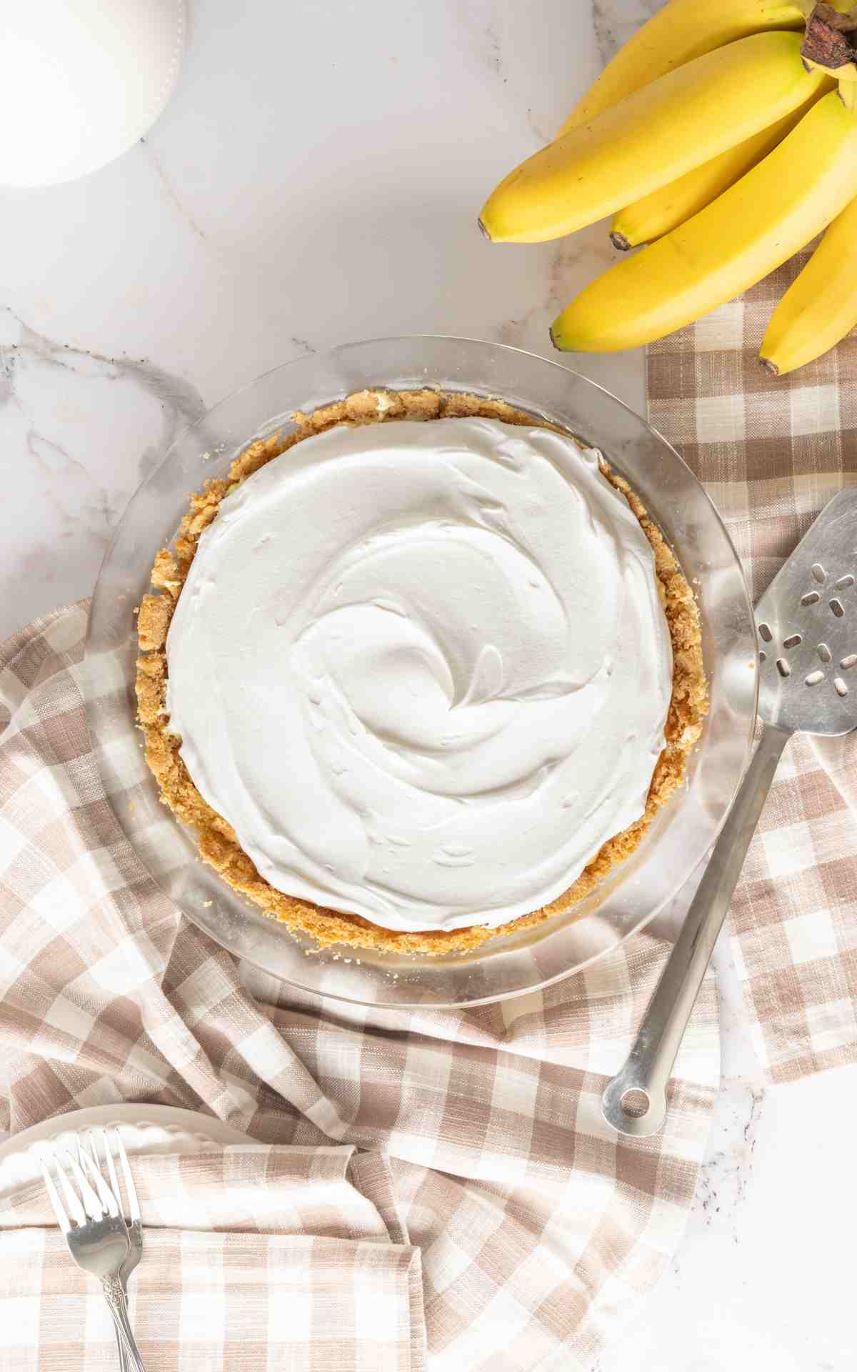 Banana cream pie with whipped cream topping.