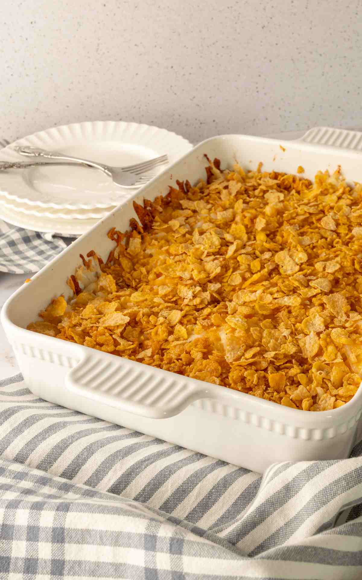 Crunchy cornflake topping on a baking dish of funeral potatoes.