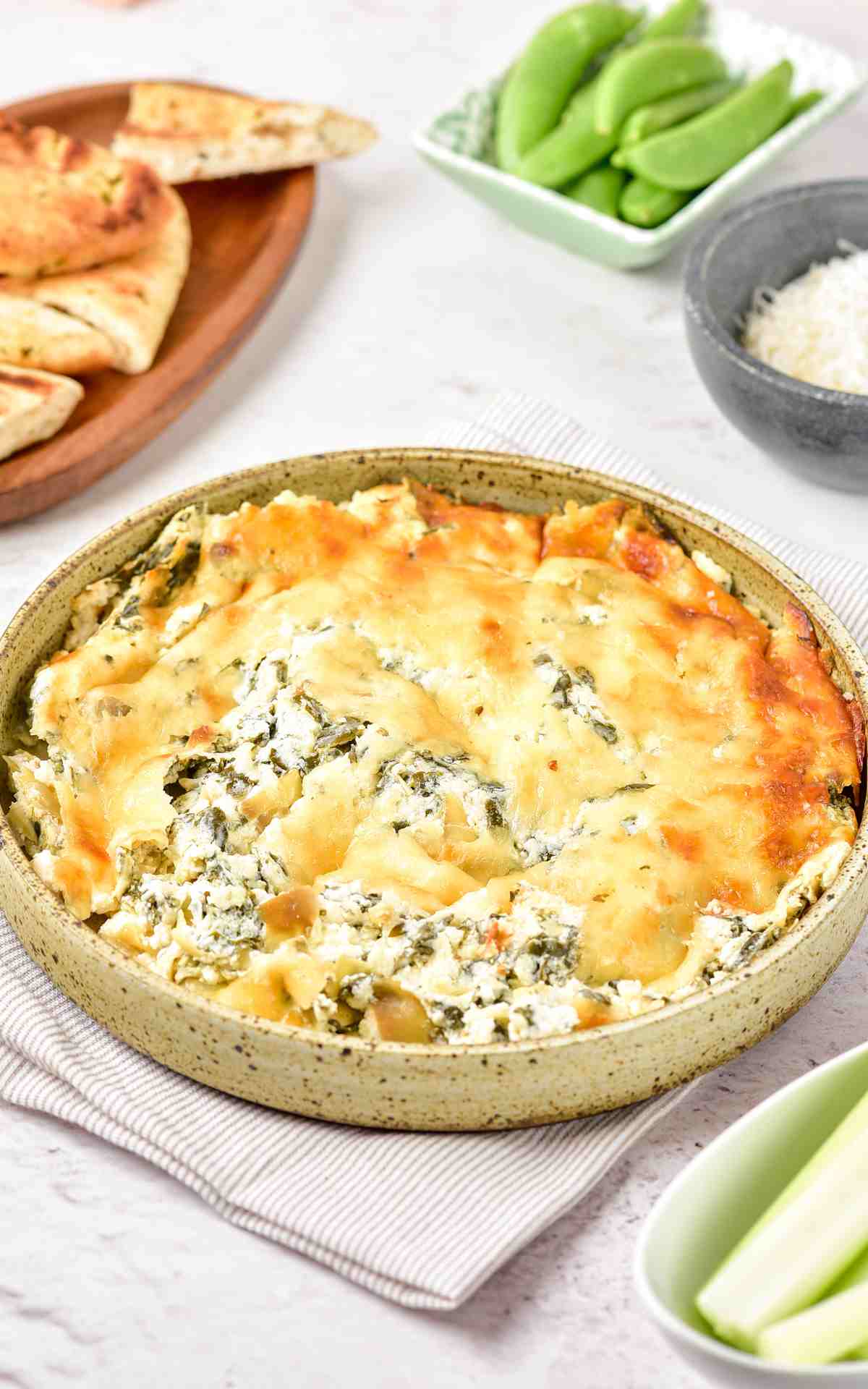 Freshly baked and hot spinach dip with artichokes.