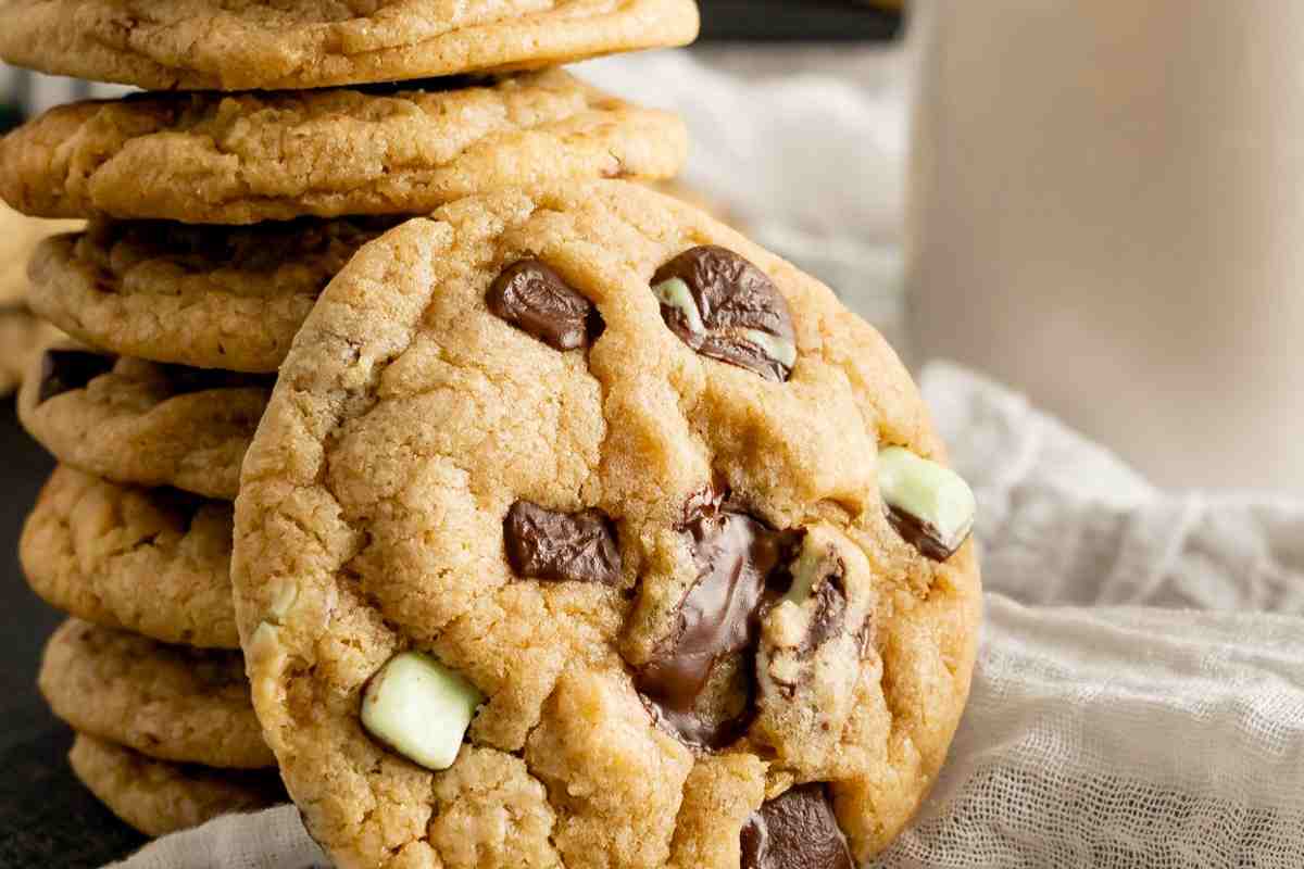 Mint Chocolate Chip cookies stacked with a leaning cookie msn image.