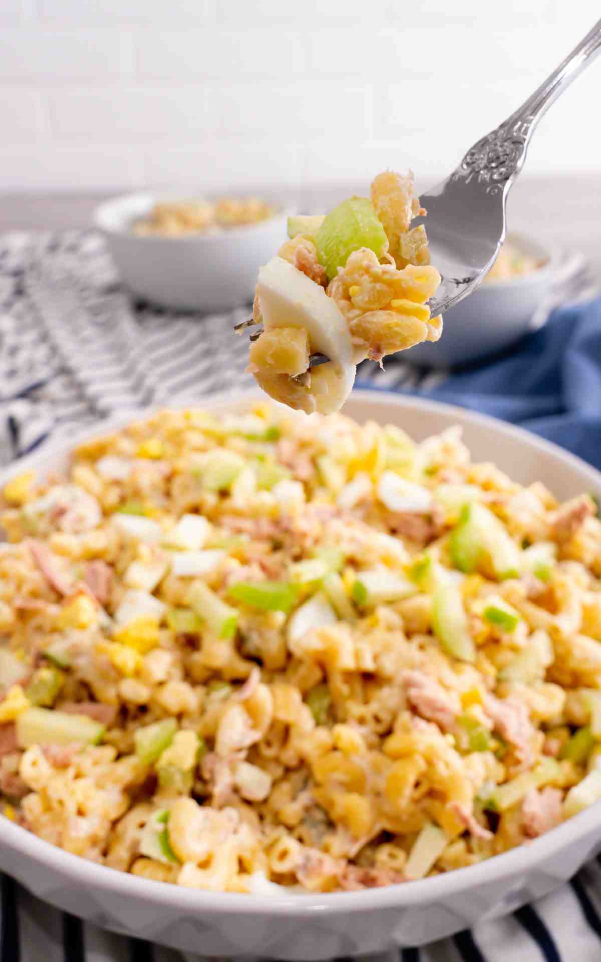 A fork stuck with pasta salad with tuna fish.