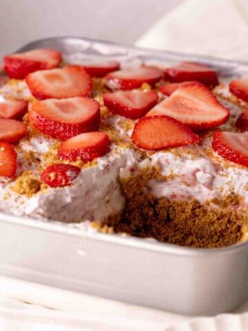No Bake Strawberry Dessert in a pan featured image.