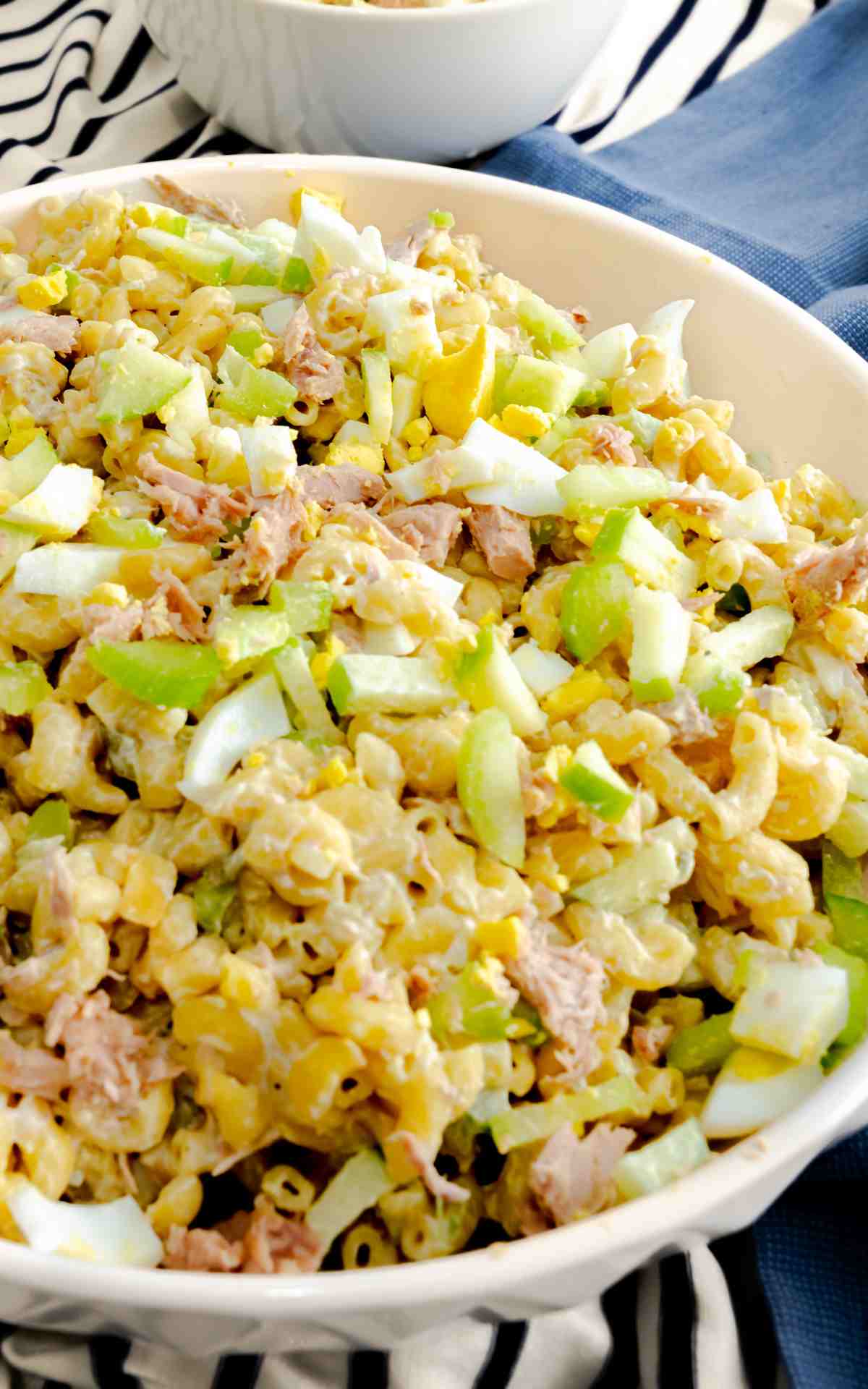 Pasta salad with tuna fish in a serving bowl.