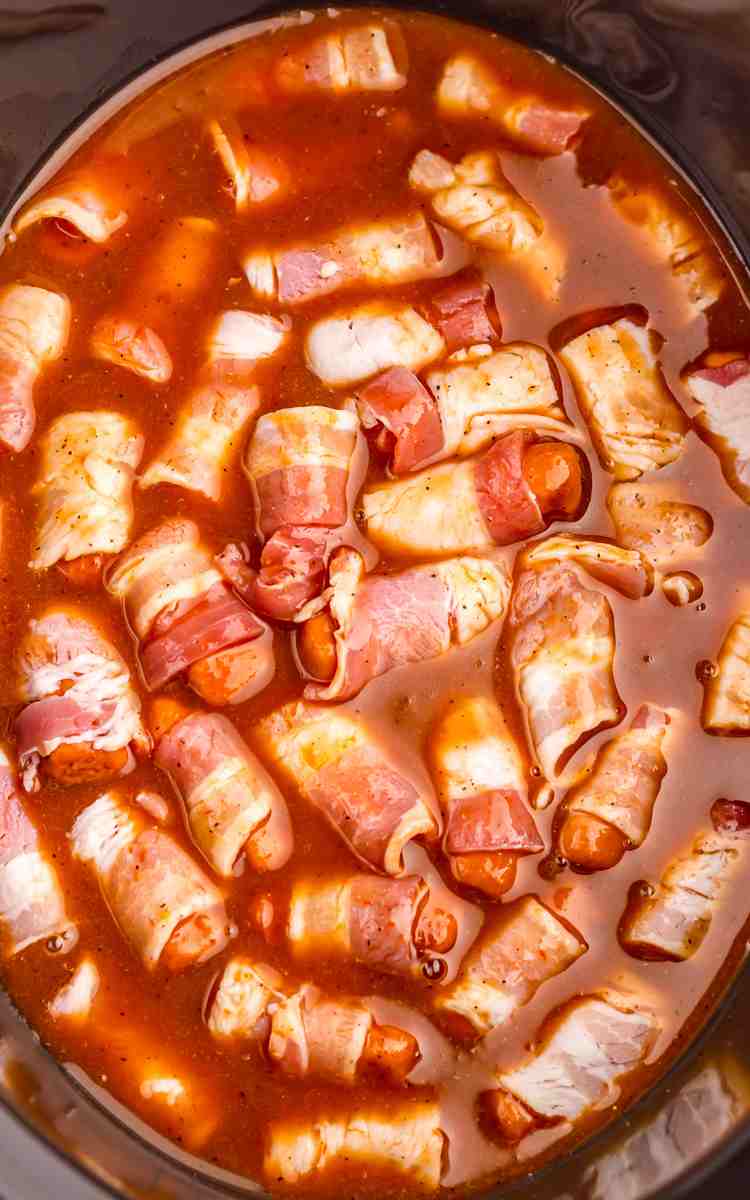 BBQ and Dr. Pepper in crockpot with uncooked little smokies.